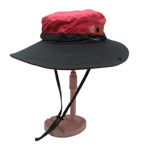 Detail of red and black outdoor sun hat with breathable mesh side and adjustable wind cord