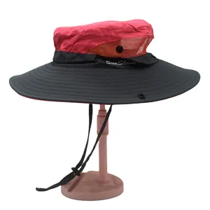 Detail of red ponytail sun hat with orange breathable mesh and adjustable chin cord