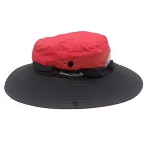 Detail of red mesh crown and black wide brim on waterproof ponytail sun hat