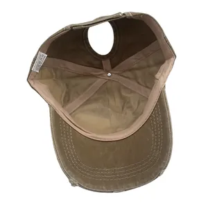 Macro view of 100% cotton washed baseball cap interior with ponytail hole and label