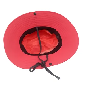 Detail of pink ponytail sun hat with orange mesh lining and adjustable wind cord