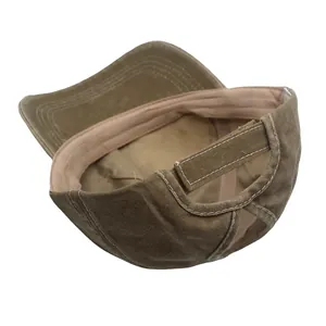 Detail of adjustable hook and loop closure and contrast stitching on washed cotton cap