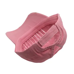 Pink washed ponytail baseball cap with adjustable Velcro strap and messy bun opening