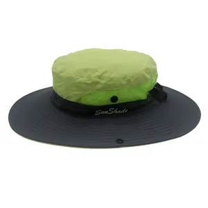 Detail of green and grey ponytail sun hat featuring breathable mesh and wide protective brim