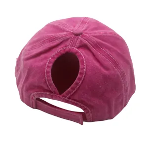 Detail view of washed cotton ponytail baseball cap with distressed finish and adjustable strap