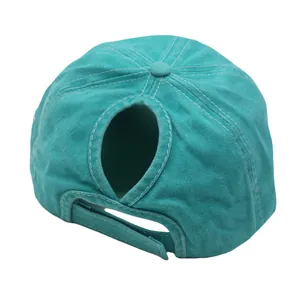 Detail view of washed cotton ponytail baseball cap with adjustable Velcro and rear opening