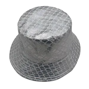 Detailed view of silver metallic fish scale texture on a fashion bucket hat surface