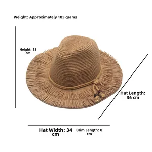 Detail showing the brown straw hat texture with frayed brim and decorative wooden beads