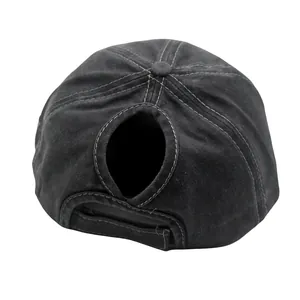 Detail view of washed cotton ponytail baseball cap with adjustable Velcro strap