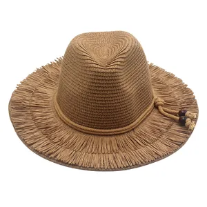 Vintage khaki straw sun hat with frayed brim and decorative wooden beads for summer beach
