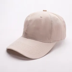 Detail view showing stitching and fabric texture of the plain cotton baseball cap