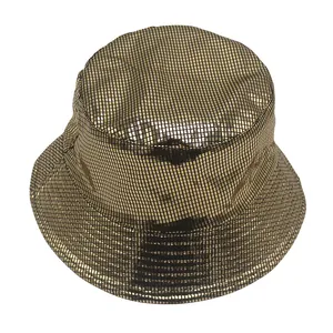 Detailed macro view of the gold bucket hat showing its metallic grid mesh texture