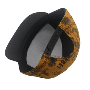 Detail of yellow snapback hat with black adjustable strap and Rebel graffiti print