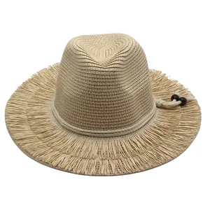 Summer wide brim straw hat with fringe edge and beaded cord for beach vacations