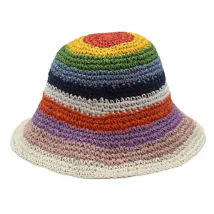 Close-up of the rainbow striped hand-woven straw hat showing detailed crochet texture
