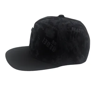 Close-up detail of 3D letter R embroidery and street graffiti print on a black hip hop cap