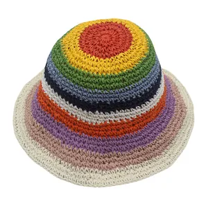 Macro detail of the colorful rainbow striped hand-woven pattern on the straw sun hat