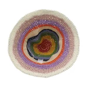 Detail view of multi-color straw hat interior with 100% paper tag and adjustable band