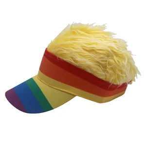 Close-up of rainbow striped visor cap featuring creative bright yellow faux hair top trim