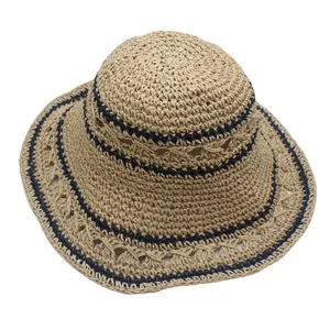 Foldable straw sun hat with navy stripes and hollow lace design for beach vacations