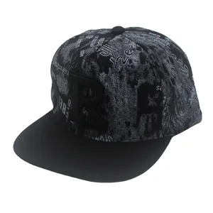 Close-up of 3D embroidered letter R and abstract graffiti print on a flat brim snapback hat