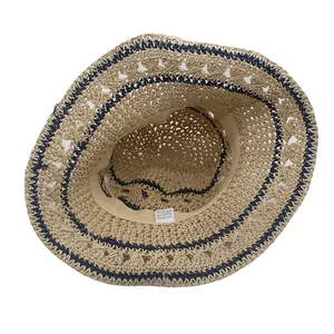 Foldable beige straw sun hat with navy wavy lines and wide brim for summer beach vacation