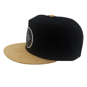 Two-tone black and khaki snapback hat with compass embroidery patch and flat brim style
