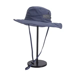 Detail of wide brim sun hat featuring breathable mesh side panels and adjustable chin strap