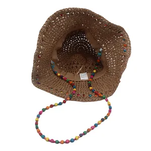Chapeau de soleil en paille marron tissé à la main avec sangle en perles pour la plage