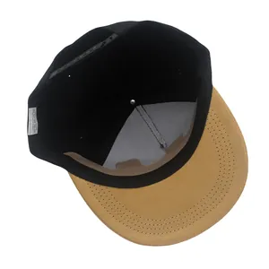 Two-tone hip hop snapback hat featuring a black crown and a tan suede-textured flat brim