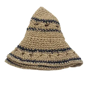 Handwoven straw sun hat with navy hollow stripes and wavy brim for summer beach vacation
