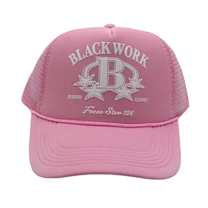 Detailed view of pink mesh trucker hat with Black Work B logo and braided rope detail