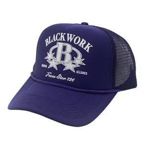 Purple mesh trucker hat with white B letter embroidery shown from a side angle