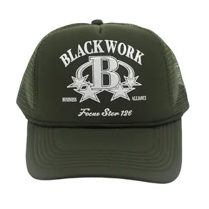 Detailed close-up of dark green mesh trucker hat with white B letter embroidery
