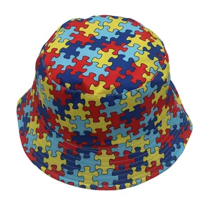 Close-up of vibrant puzzle pattern print on outdoor sun bucket hat with wide brim
