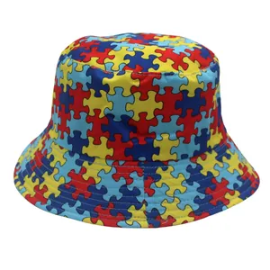 Close-up of vibrant puzzle piece print and reinforced stitching on a bucket hat
