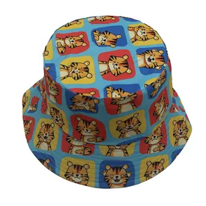 Detail view of cartoon tiger print on light blue canvas bucket hat with colorful squares