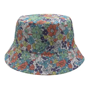 Detailed close-up showing vibrant multi-color floral print on the cotton bucket hat fabric
