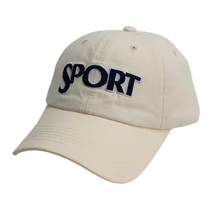 Detailed close-up of blue 'SPORT' embroidery on a beige cotton baseball cap with fine stitching