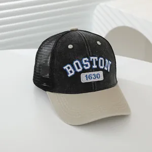 Detail of the Boston embroidery and 1630 patch on a mesh back baseball cap