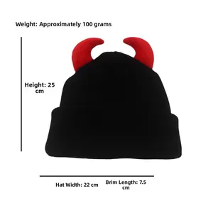 Detail view of black knit beanie with red devil horns showing 25cm height and 22cm width