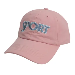 Close-up of pink baseball cap with blue 3D SPORT embroidery and reinforced stitched brim