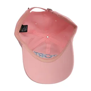 Detailed interior of a pink cotton baseball cap with blue SPORT embroidery and inner seams