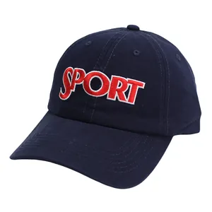 Detailed close-up of red SPORT embroidery on deep blue cotton twill baseball cap