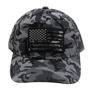 Close-up of PVC American flag patch on a camouflage tactical baseball mesh cap