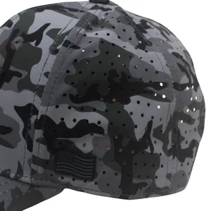 Close-up of laser-cut ventilation holes and American flag patch on camo baseball cap