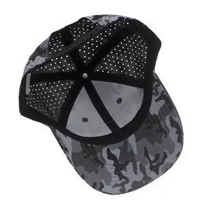 Detail view of the camouflage baseball cap interior with mesh and 100% polyester label