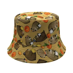 Detail of cute capybara and fruit prints on a khaki reversible cotton bucket hat