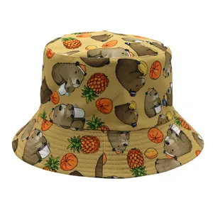 Reversible Capybara bucket hat with cartoon animal print in mustard yellow canvas fabric