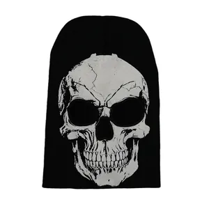 Detail of knitted skull mask featuring distressed graphic and breathable eye cutouts